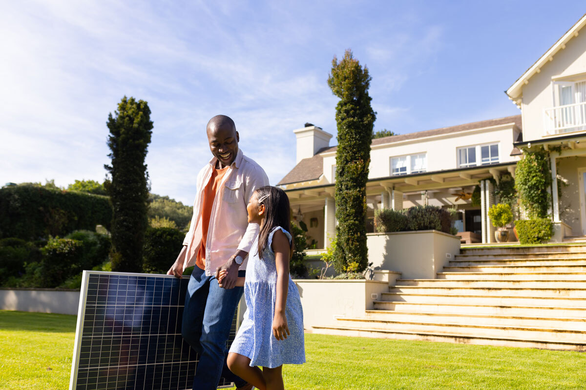 LR-carrying-solar-panel-father-and-daughter-smiling-2025-04-05-00-57-21-utc